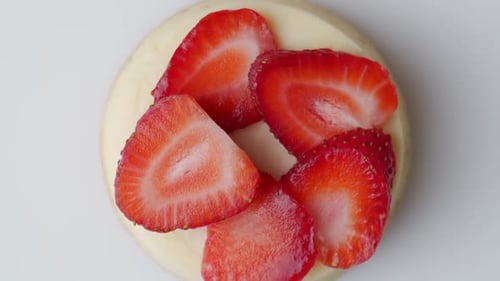 Delicious Dessert with Cream and Sliced Strawberries