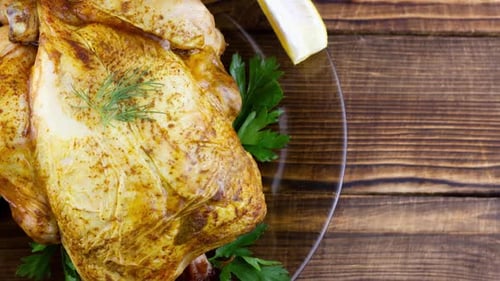 Close Up of Roasted Chicken on Wooden Table