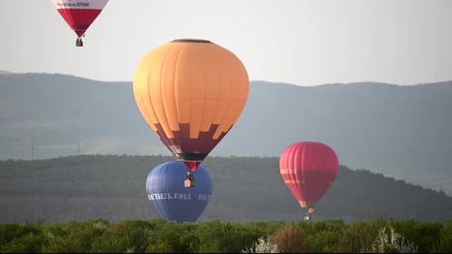 Beautiful Rocky Landscape of Crimea with Colorful Hotair Balloons Balloons Flying on Sunset HDR Time