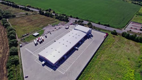 Buildings of Logistics Center Warehouses Near the Highway