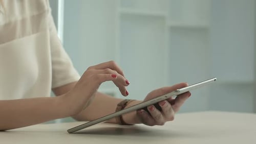 Close Up of Woman Using a Tablet