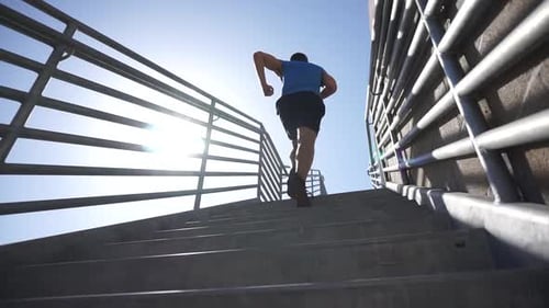 Man Runs Up Outdoor Concrete Staircase