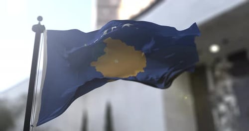 Kosovo Flag Waving in Sunlight on a Flagpole
