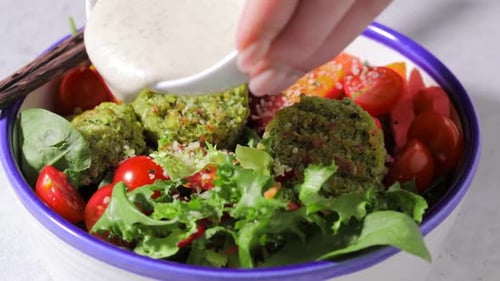 Vibrant Vegan Salad with Falafel and Creamy Sauce