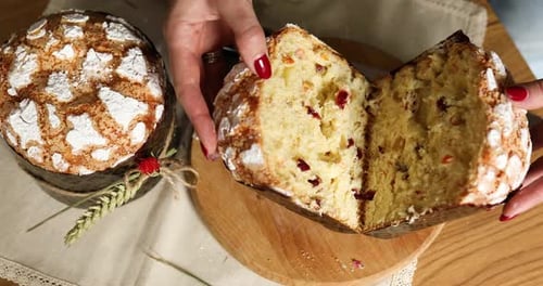Cutting into Sweet Easter Bread with Sugar
