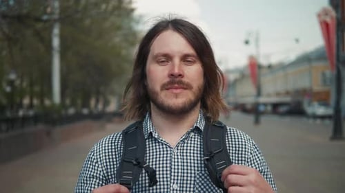 Stylish Male Tourist with Backpack Looking To Cityscape on the Embankment, Man on Vacation Outdoor