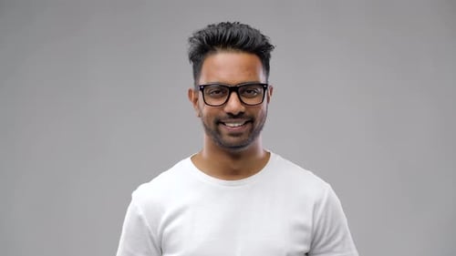 Young Adult Smiling in Studio Close Up