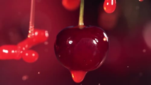 Cherries in Juice Splash Dark Red Background in Slow Motion