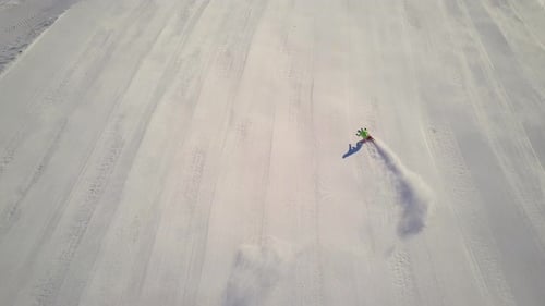 Aerial View Skiing on Freshly Prepaired Ski Slope