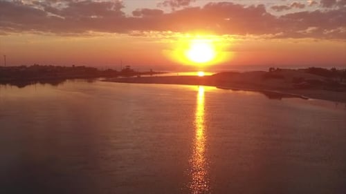 Sunrise at river with some clouds in Brazil.