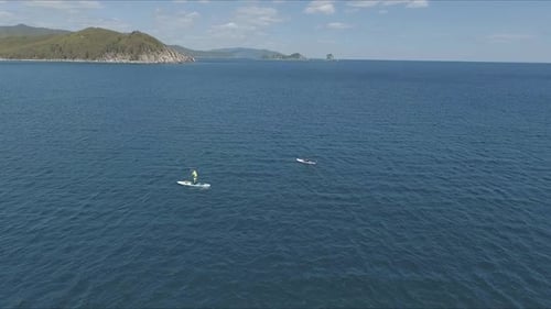 Aerial Drone Video of Sup Between 2 Men in Tropical Caribbean Waters