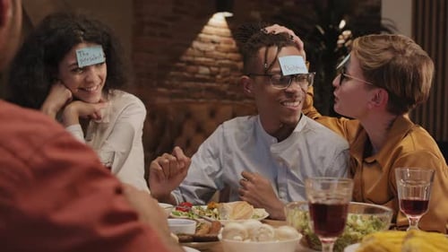 Friends Enjoying Game Night With Sticky Notes