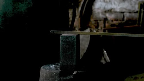 Mechanical Forging Press Impacts Metal Bar