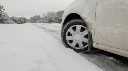 Snowy Road. The Car's Wheel Is Get In The Snow.