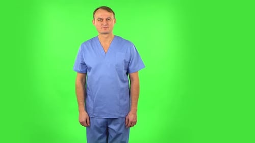 Medical Man Pointing Up Fingers. Green Screen