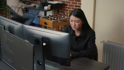 Programer Focused on Writing Code Encounters System Failure While Parsing Algorithm Sitting at Desk