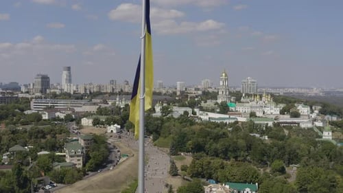 Cityscape Aerial View With Blue and Yellow Flag