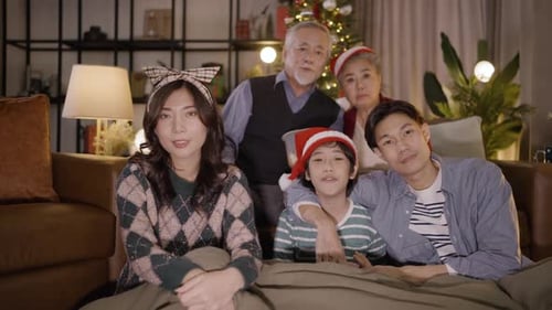 Smiling Family Celebrates Christmas at Home