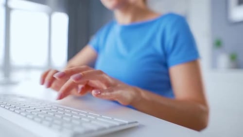 Female Hands Typing on a Computer Keyboard. Concept of Remote Work.