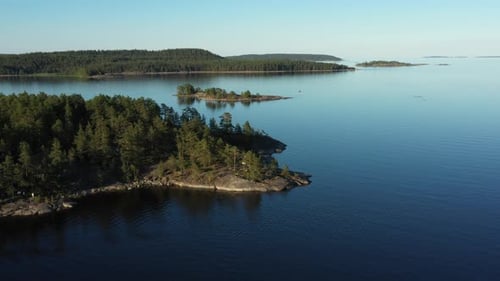 Aerial view on the lake and Islands with rocky coastline and forest in Karelia