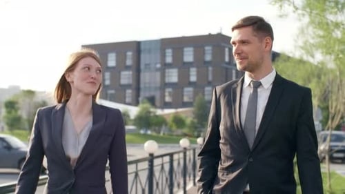 Business Colleagues Walking on Street and Talking