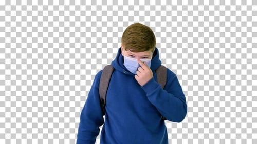 Teenager boy walking in medical mask to school, Alpha Channel