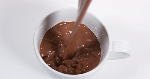 Chocolate Pouring into a Bowl, Slow Motion 4K