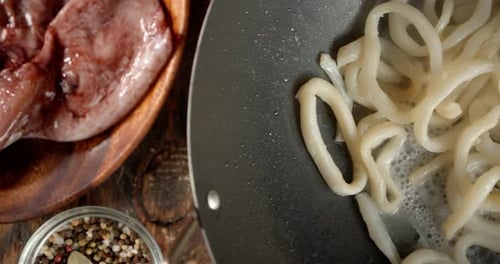 Preparing Fresh Squid Rings in Frying Pan