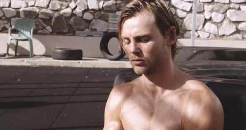 Shirtless Boxer Resting After Workout at Outdoor Gym