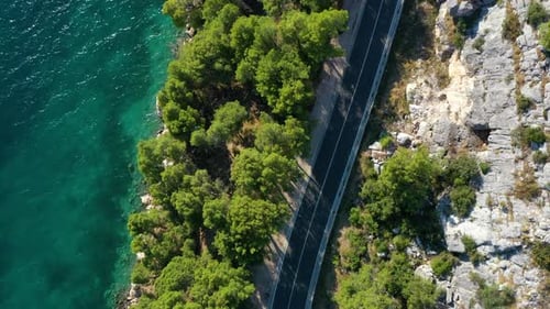 View of the road along the coast from the drone. Travel by car in summer time.