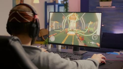 Man Plays First Person Shooter Video Game