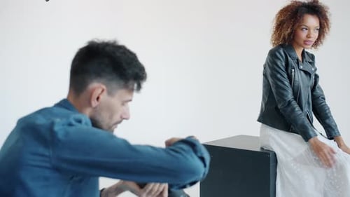 Fashion Model Poses During Photoshoot in Studio