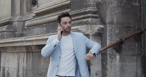Guy Talking On The Phone In A Light Suit