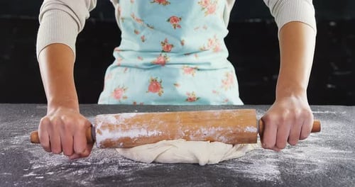 Woman using rolling pin 4k