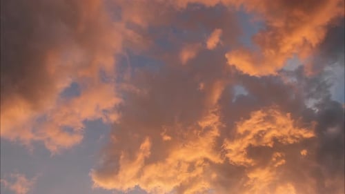 Golden Clouds Drifting at Sunset