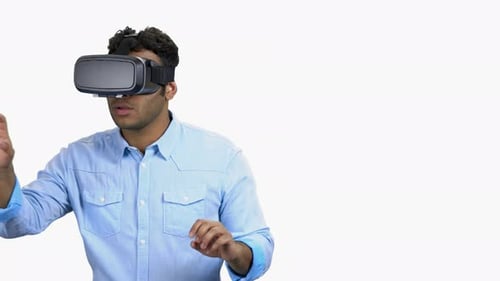 Man Uses Virtual Reality Headset, White Background