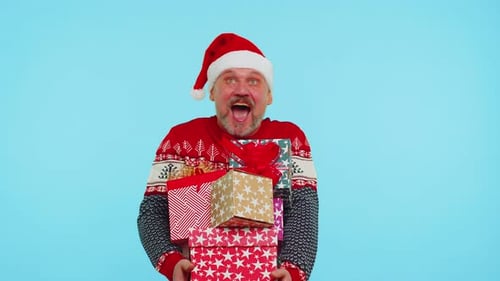 Man in Santa Hat with Christmas Gifts