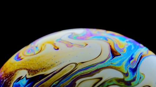 Multicolored Rainbow Colors of a Single Soap Bubble That Looks Like a Fantasy Planet Isolated