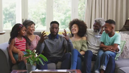 Smiling Family Enjoys Time Together on Couch