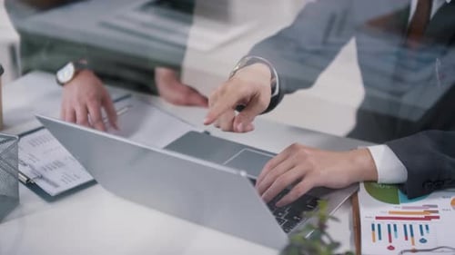 Business Professionals Working on Laptop in Bright Office