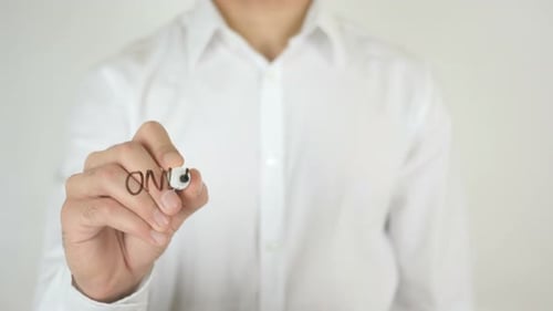 Hand Writing Online Marketing on Glass Surface