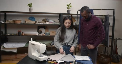 Diverse Designers Coworkers Talking in the Workshop