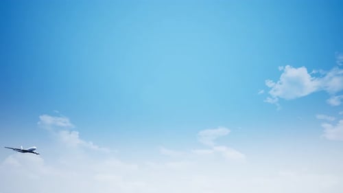 Realistic Airplane Flying Across Blue Sky with Clouds
