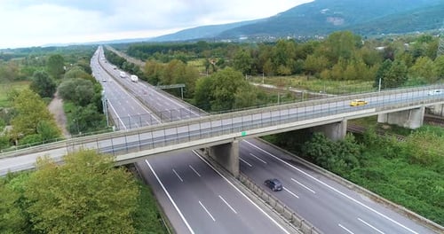 Stretching highway and mountain landscape.