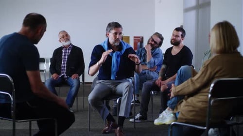 Group Meeting with Adults Sitting in Circle