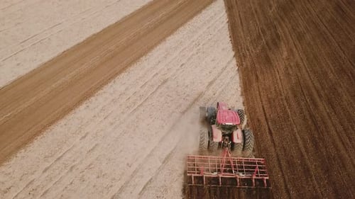 Tractor Plows a Field