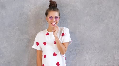 Stylish Woman Posing in Heart Dress and Sunglasses