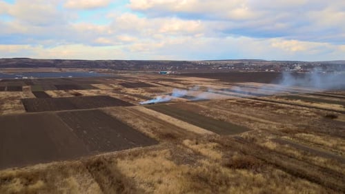 Aerial View of Grassland Field Burning with Red Fire During Dry Season