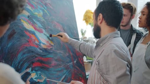 Male Artist Creating Beautiful Abstract Picture While People Multi-ethnic Group Watching