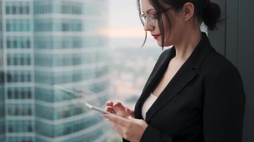 Businesswoman Using Tablet in Modern Office Building